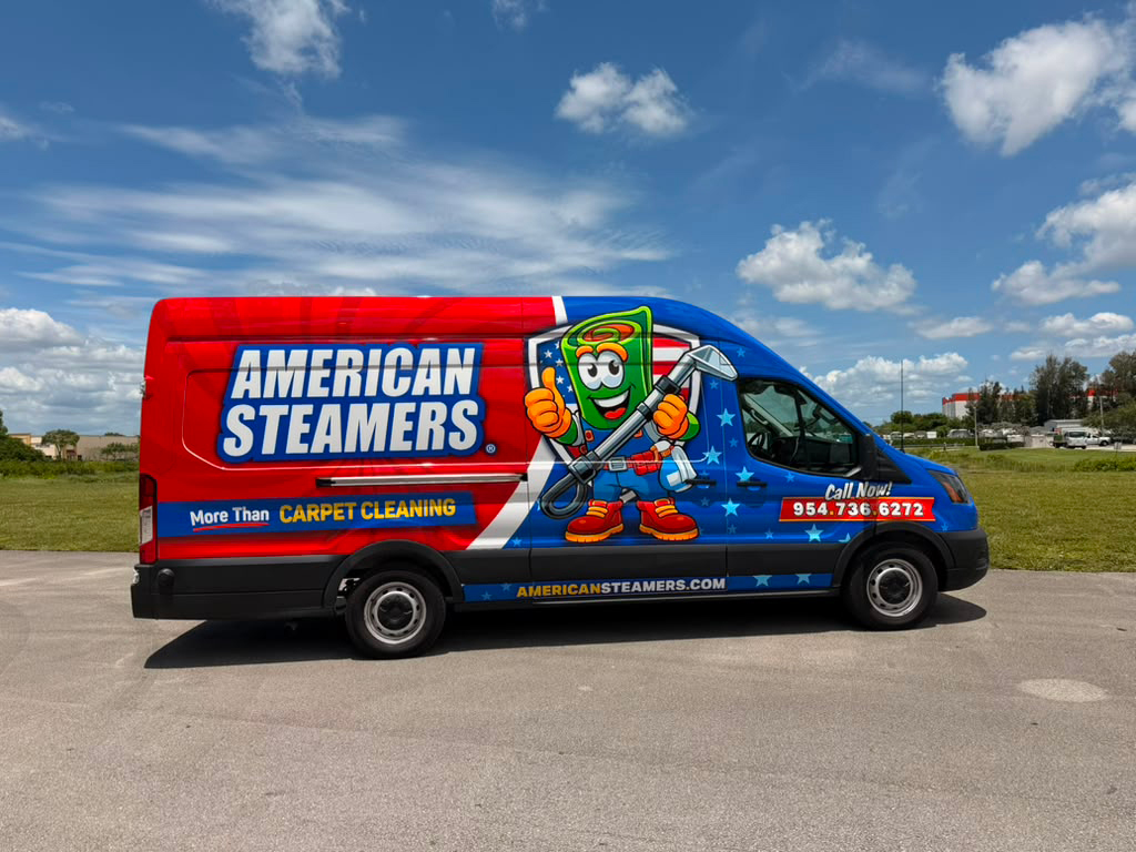 Advert for American Steamers on a red-blue service van, featuring a cartoon mascot holding tools on a starry blue background.